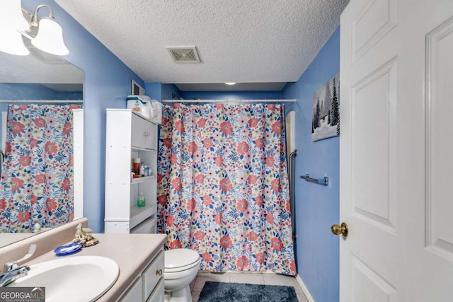 bathroom featuring vanity, a textured ceiling, curtained shower, tile patterned floors, and toilet