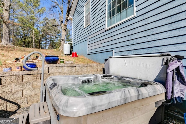 exterior details featuring a hot tub