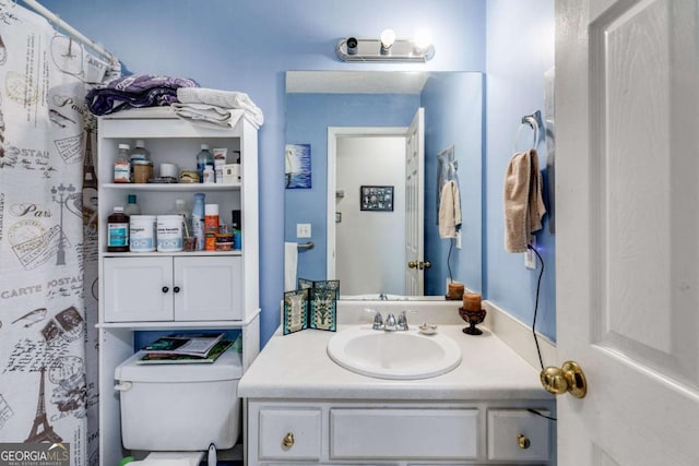 bathroom with vanity and toilet