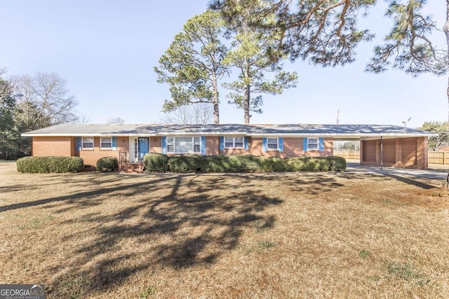 single story home featuring a carport and a front lawn