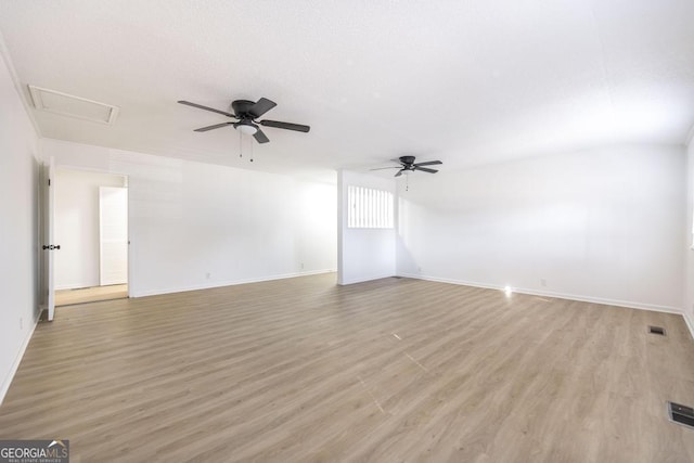 spare room with ceiling fan and light hardwood / wood-style floors