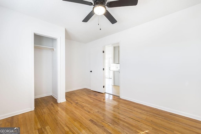 unfurnished bedroom featuring a closet, ceiling fan, and light wood-type flooring