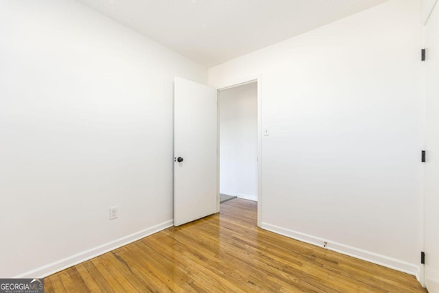 spare room featuring light hardwood / wood-style flooring