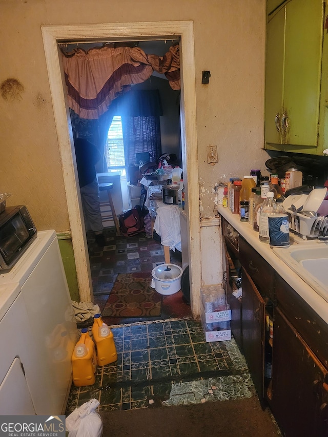 interior space featuring separate washer and dryer and vanity