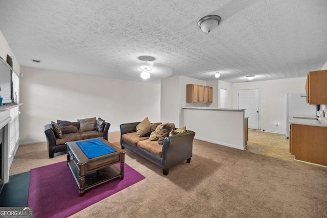 living room with light colored carpet and a textured ceiling