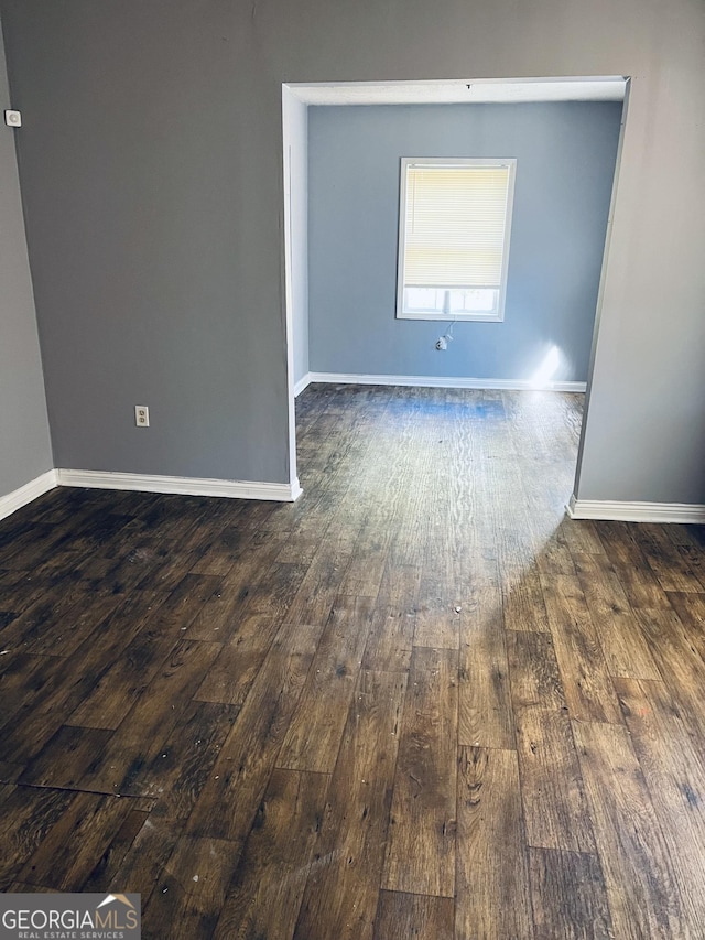 empty room featuring dark hardwood / wood-style floors