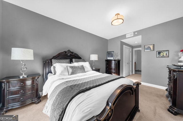 bedroom featuring light carpet