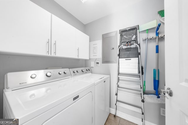 laundry room with washer and clothes dryer, electric panel, and cabinets