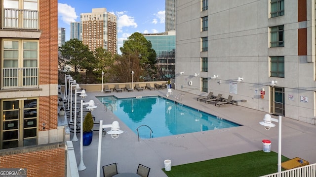 view of swimming pool featuring a patio