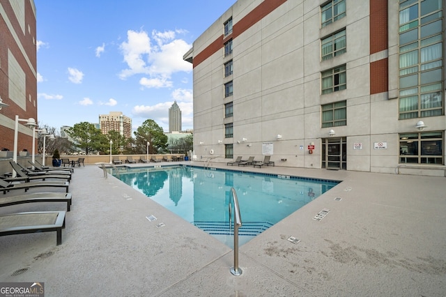 view of swimming pool with a patio area