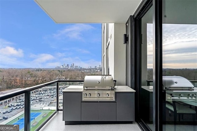 balcony featuring area for grilling and exterior kitchen