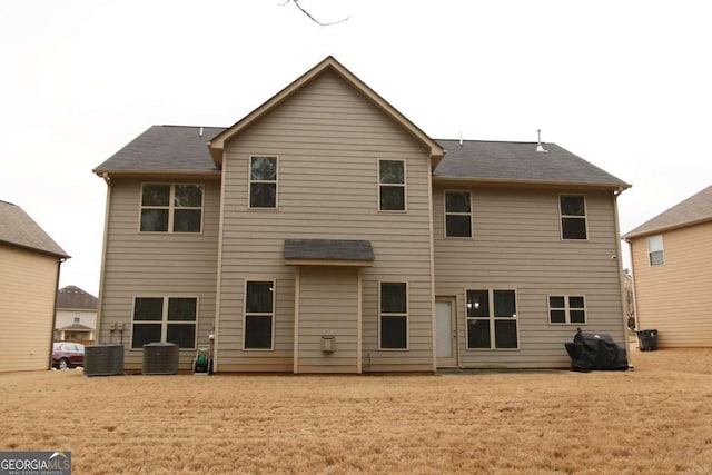 rear view of property featuring central air condition unit