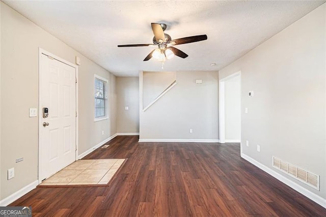 foyer featuring dark wood-type flooring and ceiling fan