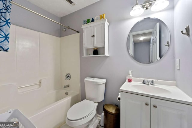 full bathroom with vanity, toilet, and washtub / shower combination