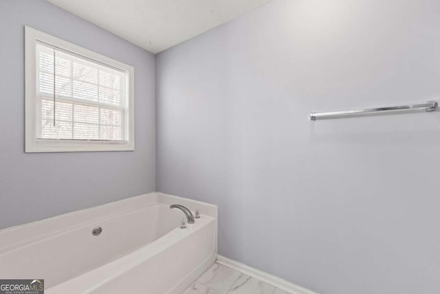 bathroom featuring a tub to relax in