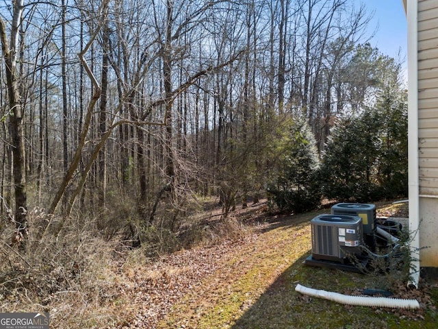 view of yard featuring central AC unit