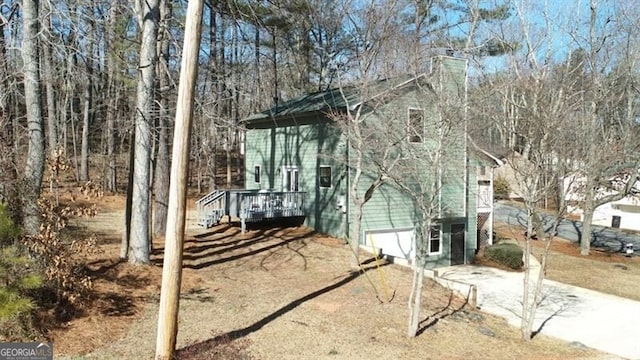 view of property exterior featuring a deck