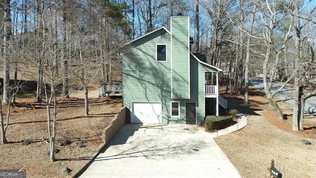 view of side of home featuring a garage