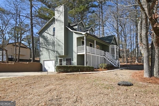 view of side of property with a garage