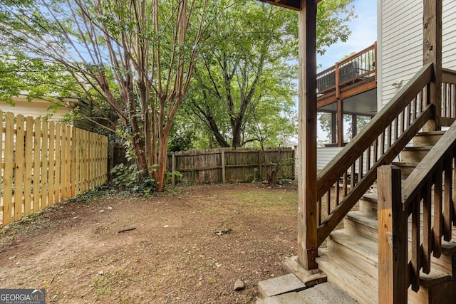 view of yard featuring a balcony