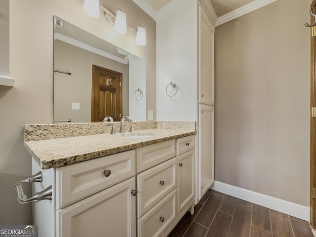 bathroom with vanity and crown molding