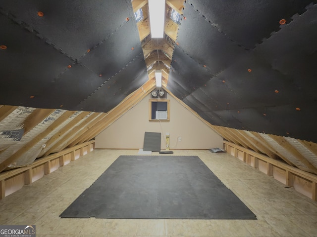 additional living space featuring vaulted ceiling