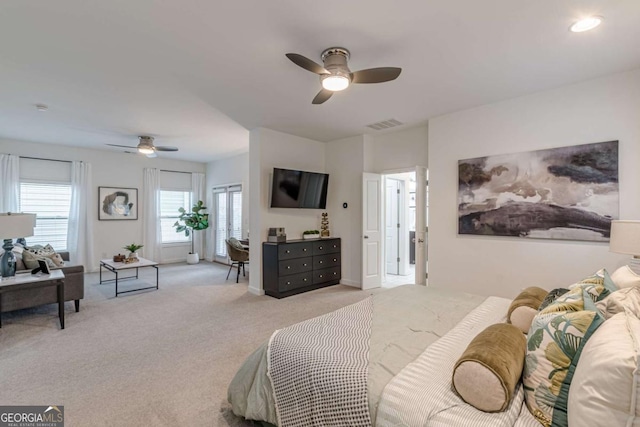 carpeted bedroom with ceiling fan