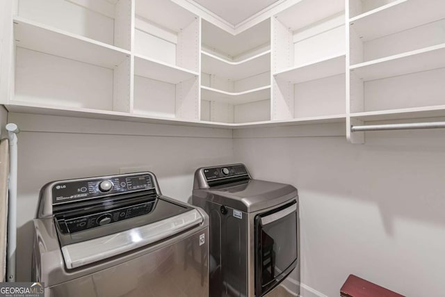 laundry area featuring washing machine and clothes dryer