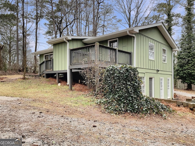 view of side of home with a deck