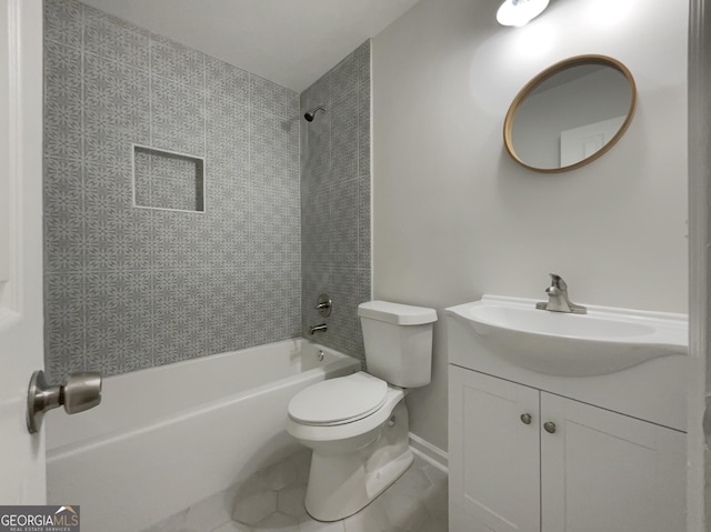 full bathroom with tiled shower / bath combo, vanity, tile patterned floors, and toilet