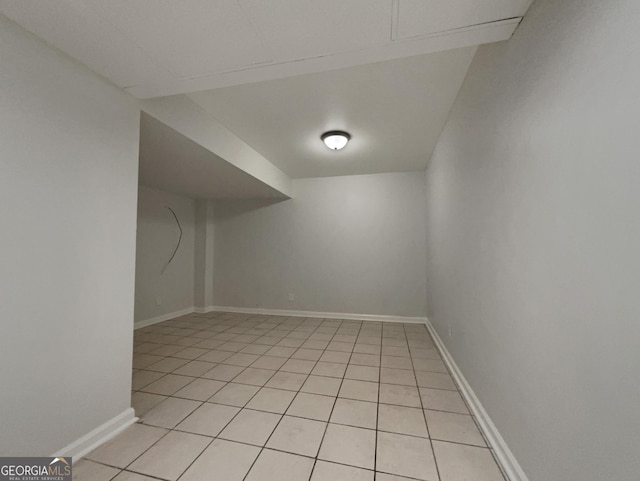 additional living space featuring light tile patterned floors