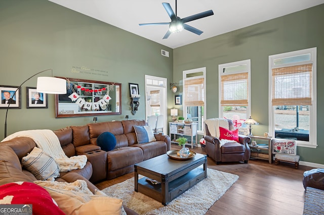 living room featuring hardwood / wood-style flooring and ceiling fan