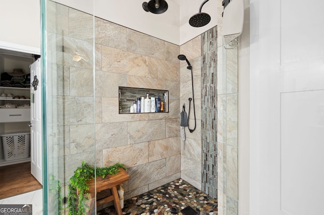 bathroom with a tile shower