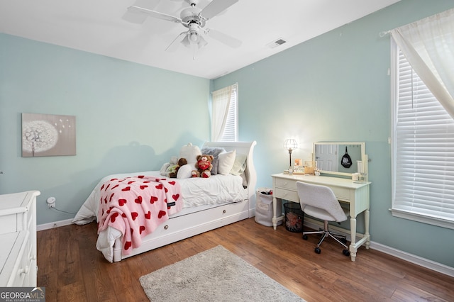 bedroom with wood-type flooring and ceiling fan