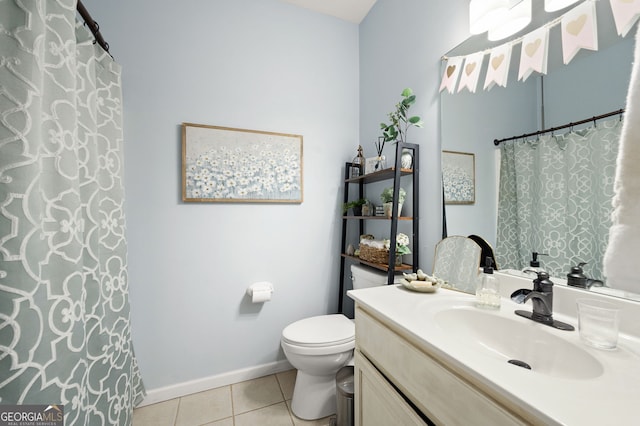 bathroom with vanity, toilet, and tile patterned flooring