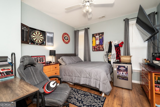 bedroom with hardwood / wood-style flooring and ceiling fan