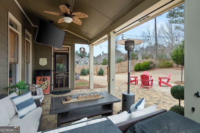 view of patio / terrace with an outdoor living space and ceiling fan