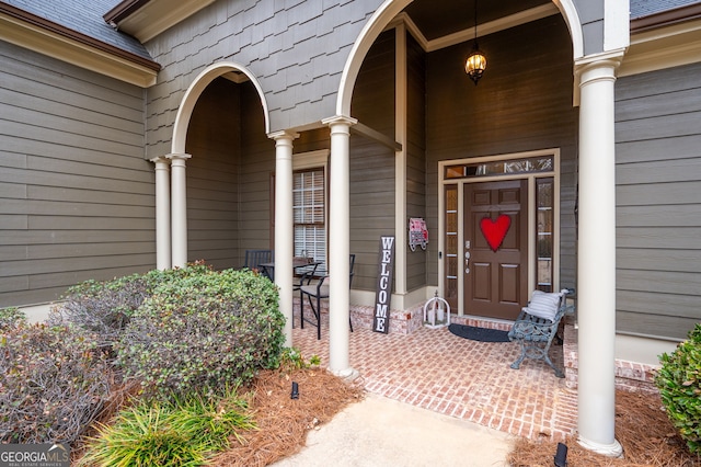 doorway to property with covered porch