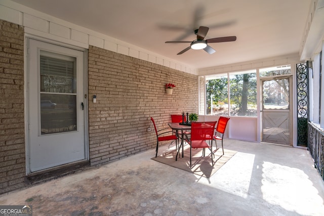 sunroom / solarium with ceiling fan