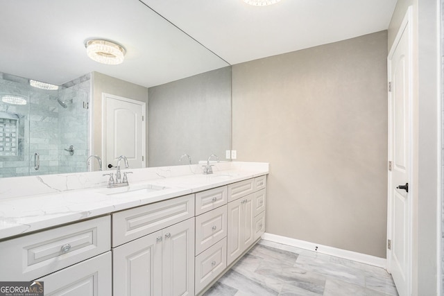 bathroom with vanity and a shower with shower door