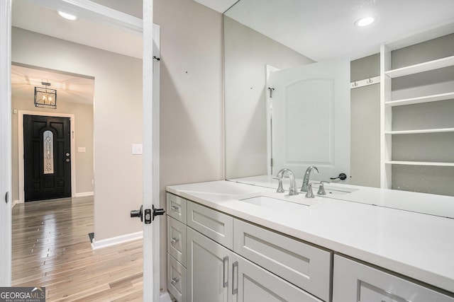 bathroom with vanity and hardwood / wood-style floors