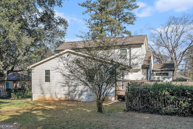 view of home's exterior featuring a lawn