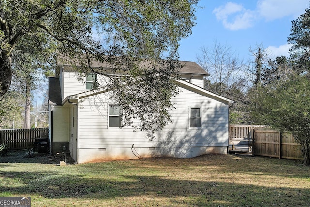 back of property featuring a lawn