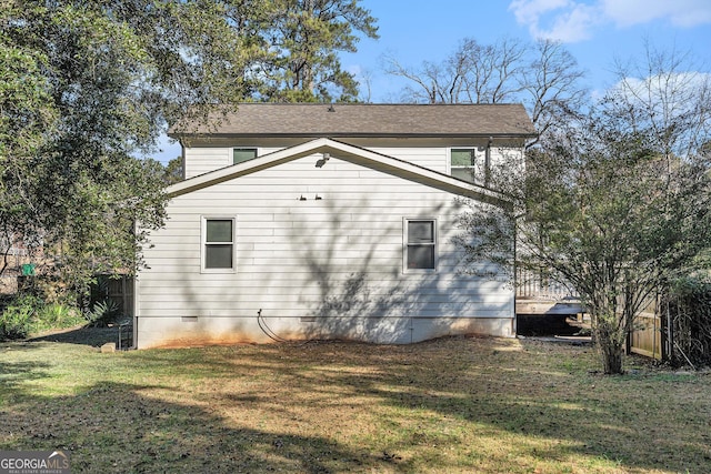 view of property exterior with a yard