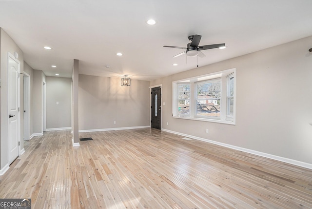 spare room featuring ceiling fan and light hardwood / wood-style floors