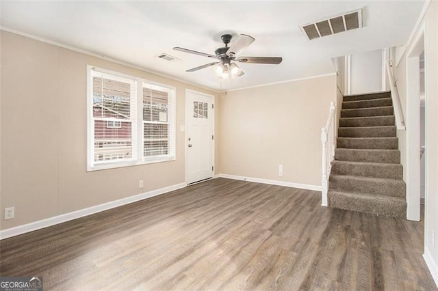 interior space featuring crown molding, dark hardwood / wood-style floors, and ceiling fan