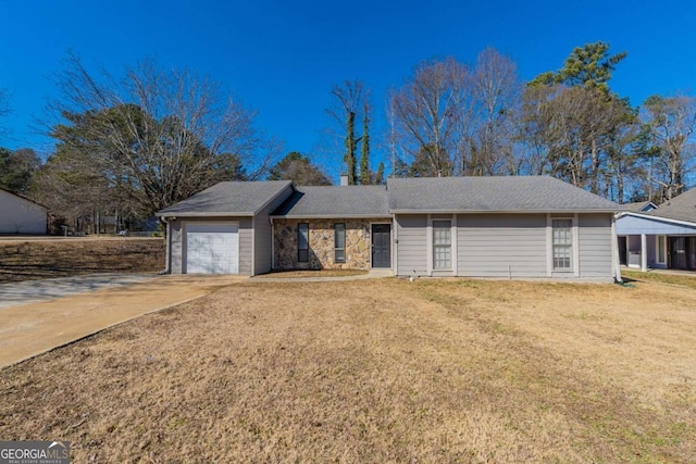 ranch-style house with a garage and a front yard