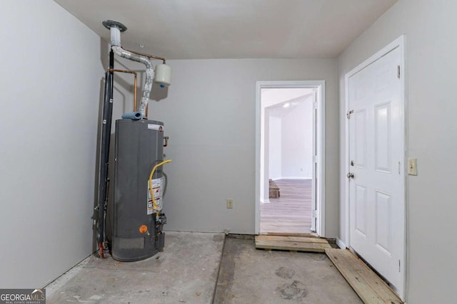 utility room featuring water heater