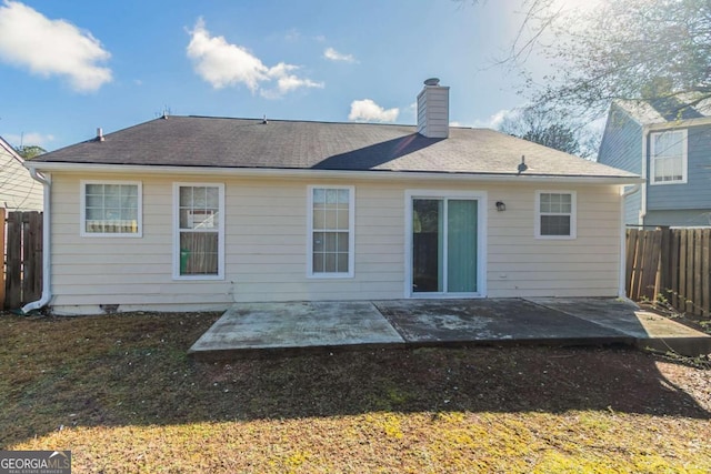 rear view of property with a patio area