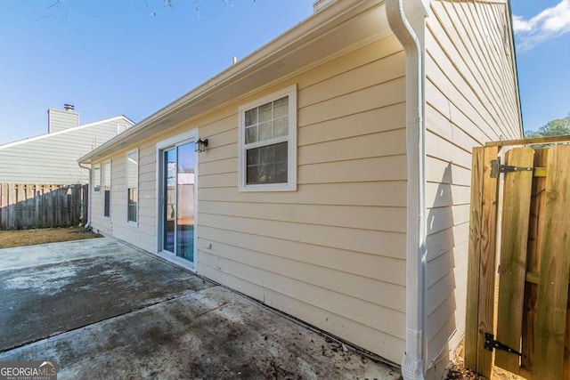 view of side of home featuring a patio